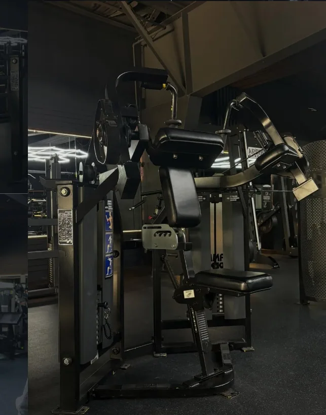 Plate loaded strength machine on the Lexington gym floor